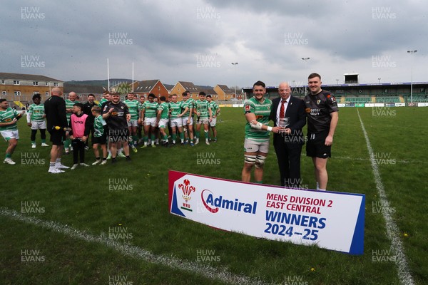 260425 - Caerphilly v Taffs Well - Admiral National League 2 East Central -  Roy Wilkinson of Welsh Rugby Union presents trophy to Caerphilly RFC captain Sam Haley (in black) and captain of todays match Tom Axenderrie
