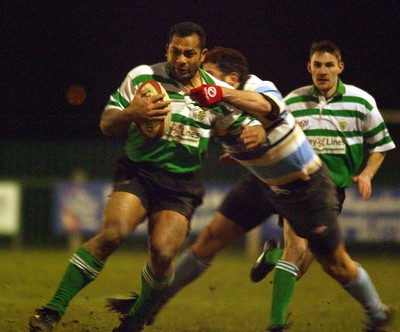 140203 - Caerphilly v Ebbw Vale - Welsh Premiership - Taunaholo Taufahema is tackled by Chay Billen