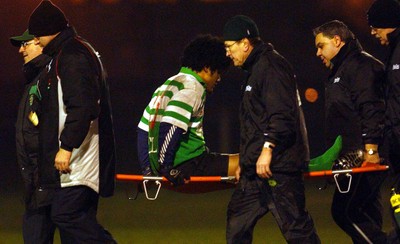 140203 - Caerphilly v Ebbw Vale - Welsh Premiership - Caerphilly's Sione Tuipulotu is stretchered off with an ankle injury