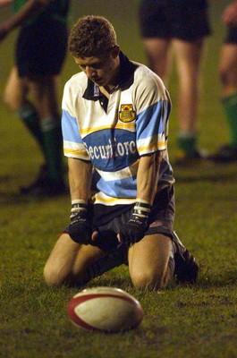 140203 - Caerphilly v Ebbw Vale - Welsh Premiership - Andrew Bevan sits dejected after dropping a pass that could have saved the game for Ebbw Vale