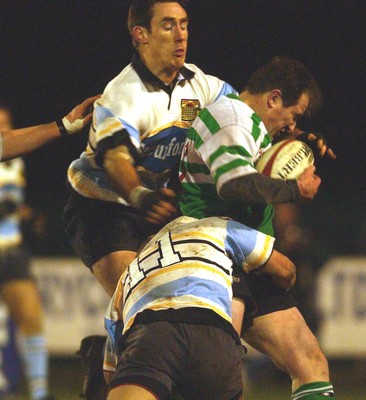 140203 - Caerphilly v Ebbw Vale - Welsh Premiership - Caerphilly's Roddy Boobyer gets tackled by Andrew Bevan (11) and Rhys Shorney