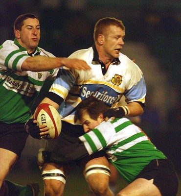 140203 - Caerphilly v Ebbw Vale - Welsh Premiership - Ebbw Vale's Chay Billen is tackled by Graham Williams and Roddy Boobyer