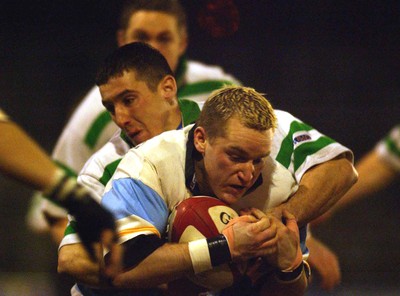 140203 - Caerphilly v Ebbw Vale - Welsh Premiership - Ebbw Vale's Bryan Shelbourne gets smothered by Ryan Howells