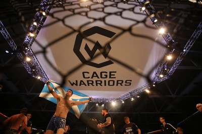 081218 - Cage Warriors 100 - Aidan Stephen celebrates his win over Wales' Kris Edwards