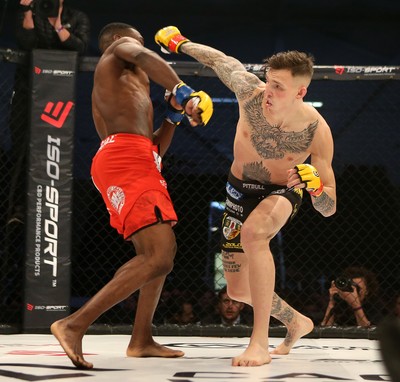 081218 - Cage Warriors 100 - Rhys McKee (Black shorts) v Jefferson George (Red shorts) during their lightweight fight