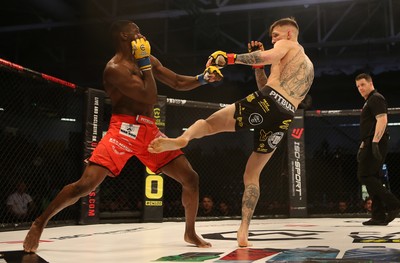 081218 - Cage Warriors 100 - Rhys McKee (Black shorts) v Jefferson George (Red shorts) during their lightweight fight