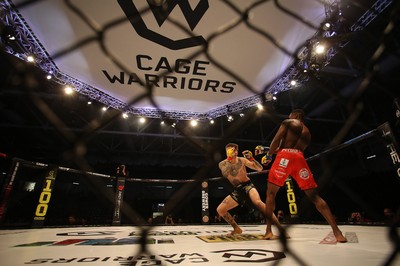 081218 - Cage Warriors 100 - Rhys McKee (Black shorts) v Jefferson George (Red shorts) during their lightweight fight