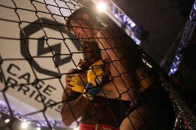 081218 - Cage Warriors 100 - Rhys McKee (Black shorts) v Jefferson George (Red shorts) during their lightweight fight