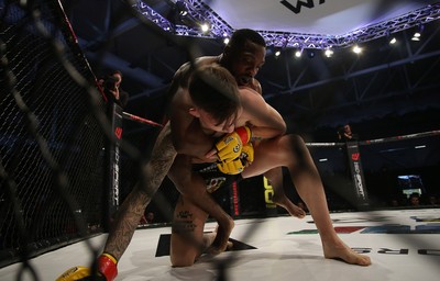 081218 - Cage Warriors 100 - Rhys McKee (Black shorts) v Jefferson George (Red shorts) during their lightweight fight