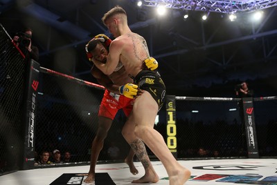 081218 - Cage Warriors 100 - Rhys McKee (Black shorts) v Jefferson George (Red shorts) during their lightweight fight