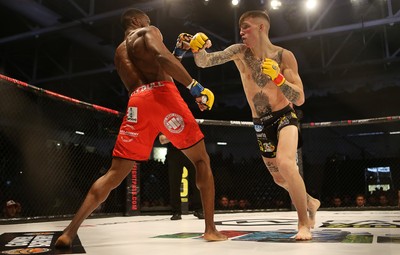 081218 - Cage Warriors 100 - Rhys McKee (Black shorts) v Jefferson George (Red shorts) during their lightweight fight