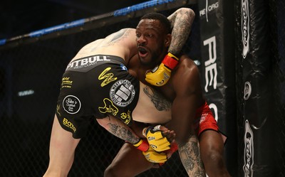 081218 - Cage Warriors 100 - Rhys McKee (Black shorts) v Jefferson George (Red shorts) during their lightweight fight