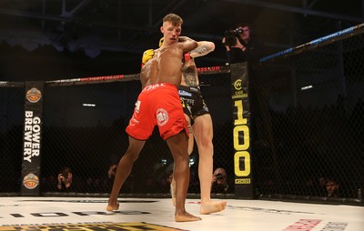 081218 - Cage Warriors 100 - Rhys McKee (Black shorts) v Jefferson George (Red shorts) during their lightweight fight