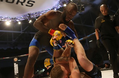 081218 - Cage Warriors 100 - Alex Lohore (Blue shorts) v Tim Barnett (Black shorts) during their Welterweight fight