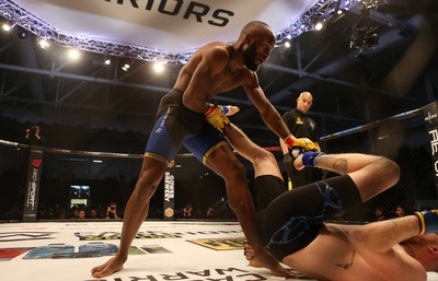 081218 - Cage Warriors 100 - Alex Lohore (Blue shorts) v Tim Barnett (Black shorts) during their Welterweight fight