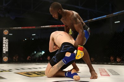 081218 - Cage Warriors 100 - Alex Lohore (Blue shorts) v Tim Barnett (Black shorts) during their Welterweight fight