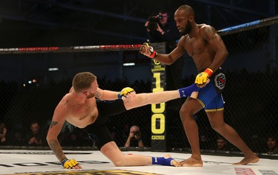 081218 - Cage Warriors 100 - Alex Lohore (Blue shorts) v Tim Barnett (Black shorts) during their Welterweight fight