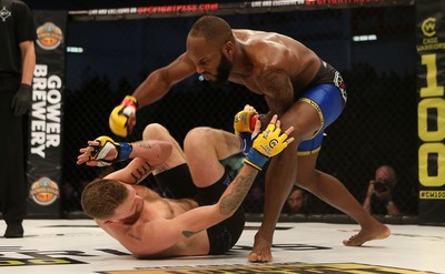 081218 - Cage Warriors 100 - Alex Lohore (Blue shorts) v Tim Barnett (Black shorts) during their Welterweight fight