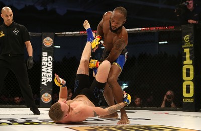 081218 - Cage Warriors 100 - Alex Lohore (Blue shorts) v Tim Barnett (Black shorts) during their Welterweight fight