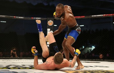 081218 - Cage Warriors 100 - Alex Lohore (Blue shorts) v Tim Barnett (Black shorts) during their Welterweight fight