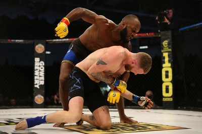 081218 - Cage Warriors 100 - Alex Lohore (Blue shorts) v Tim Barnett (Black shorts) during their Welterweight fight