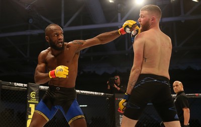 081218 - Cage Warriors 100 - Alex Lohore (Blue shorts) v Tim Barnett (Black shorts) during their Welterweight fight