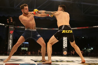 081218 - Cage Warriors 100 - Hakon Foss (black shorts) v Aaron Khalid of Wales (blue shorts) during their Welterweight fight