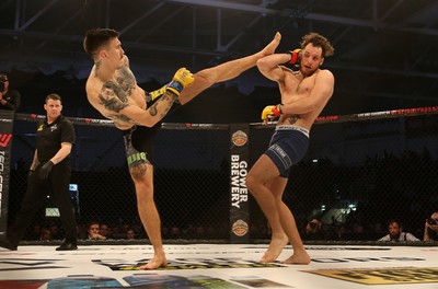 081218 - Cage Warriors 100 - Hakon Foss (black shorts) v Aaron Khalid of Wales (blue shorts) during their Welterweight fight