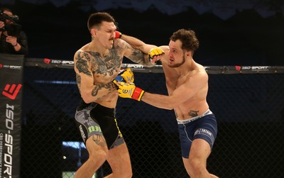 081218 - Cage Warriors 100 - Hakon Foss (black shorts) v Aaron Khalid of Wales (blue shorts) during their Welterweight fight