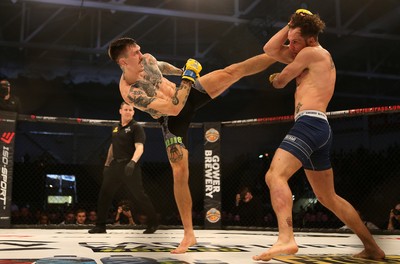 081218 - Cage Warriors 100 - Hakon Foss (black shorts) v Aaron Khalid of Wales (blue shorts) during their Welterweight fight