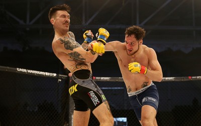 081218 - Cage Warriors 100 - Hakon Foss (black shorts) v Aaron Khalid of Wales (blue shorts) during their Welterweight fight