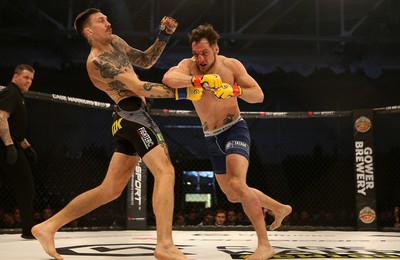 081218 - Cage Warriors 100 - Hakon Foss (black shorts) v Aaron Khalid of Wales (blue shorts) during their Welterweight fight