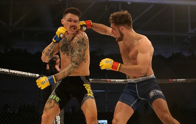 081218 - Cage Warriors 100 - Hakon Foss (black shorts) v Aaron Khalid of Wales (blue shorts) during their Welterweight fight