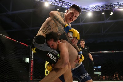 081218 - Cage Warriors 100 - Hakon Foss (black shorts) v Aaron Khalid of Wales (blue shorts) during their Welterweight fight