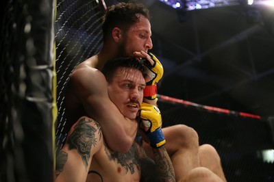 081218 - Cage Warriors 100 - Hakon Foss (black shorts) v Aaron Khalid of Wales (blue shorts) during their Welterweight fight