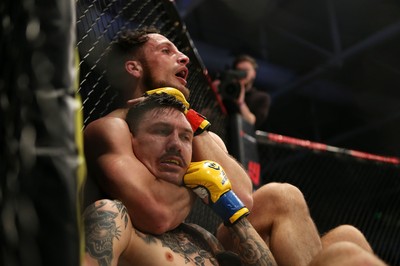 081218 - Cage Warriors 100 - Hakon Foss (black shorts) v Aaron Khalid of Wales (blue shorts) during their Welterweight fight