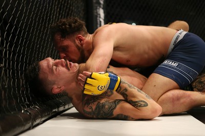 081218 - Cage Warriors 100 - Hakon Foss (black shorts) v Aaron Khalid of Wales (blue shorts) during their Welterweight fight