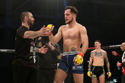 081218 - Cage Warriors 100 - Hakon Foss (black shorts) v Aaron Khalid of Wales (blue shorts) during their Welterweight fight