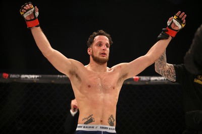 081218 - Cage Warriors 100 - Wales' Aaron Khalid celebrates winning against Hakon Foss