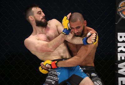 081218 - Cage Warriors 100 - Aiden Lee (grey shorts) v Dean Trueman (blue shorts) during their featherweight title fight