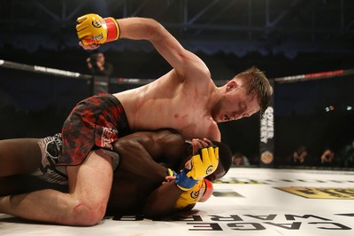 091218 - Cage Warriors 100 - Wales' Jack Shore dominates Mike Ekundayo during their Bantamweight title fight