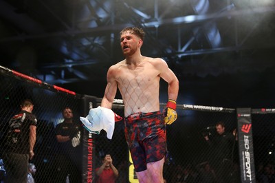 091218 - Cage Warriors 100 - Wales' Jack Shore celebrates victory over Mike Ekundayo to win the world title