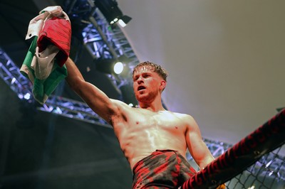 091218 - Cage Warriors 100 - Wales' Jack Shore celebrates victory over Mike Ekundayo to win the world title