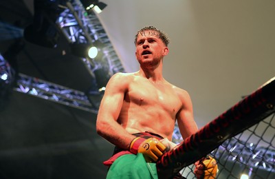 091218 - Cage Warriors 100 - Wales' Jack Shore celebrates victory over Mike Ekundayo to win the world title