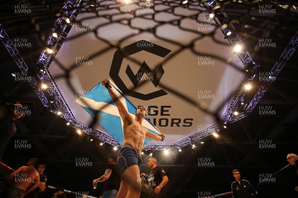 081218 - Cage Warriors 100 - Aidan Stephen celebrates his win over Wales' Kris Edwards