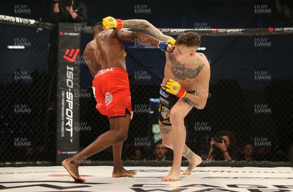 081218 - Cage Warriors 100 - Rhys McKee (Black shorts) v Jefferson George (Red shorts) during their lightweight fight