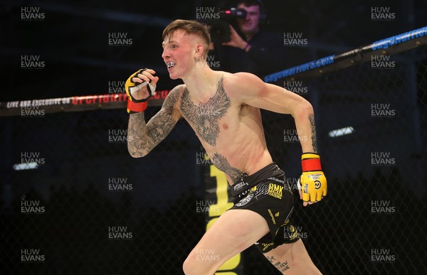 081218 - Cage Warriors 100 - Rhys McKee celebrates victory over Jefferson George