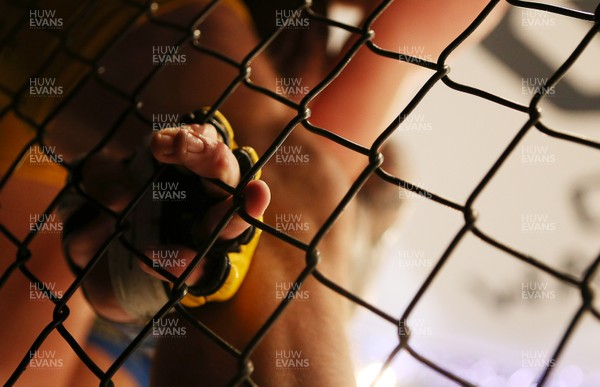 081218 - Cage Warriors 100 - Nicolas Dalby (Yellow shorts) v Philip Mulpeter (blue shorts) during their welterweight fight