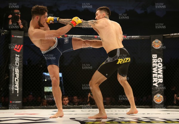 081218 - Cage Warriors 100 - Hakon Foss (black shorts) v Aaron Khalid of Wales (blue shorts) during their Welterweight fight