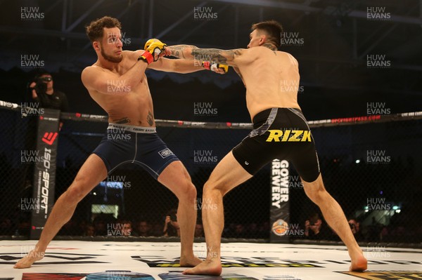 081218 - Cage Warriors 100 - Hakon Foss (black shorts) v Aaron Khalid of Wales (blue shorts) during their Welterweight fight